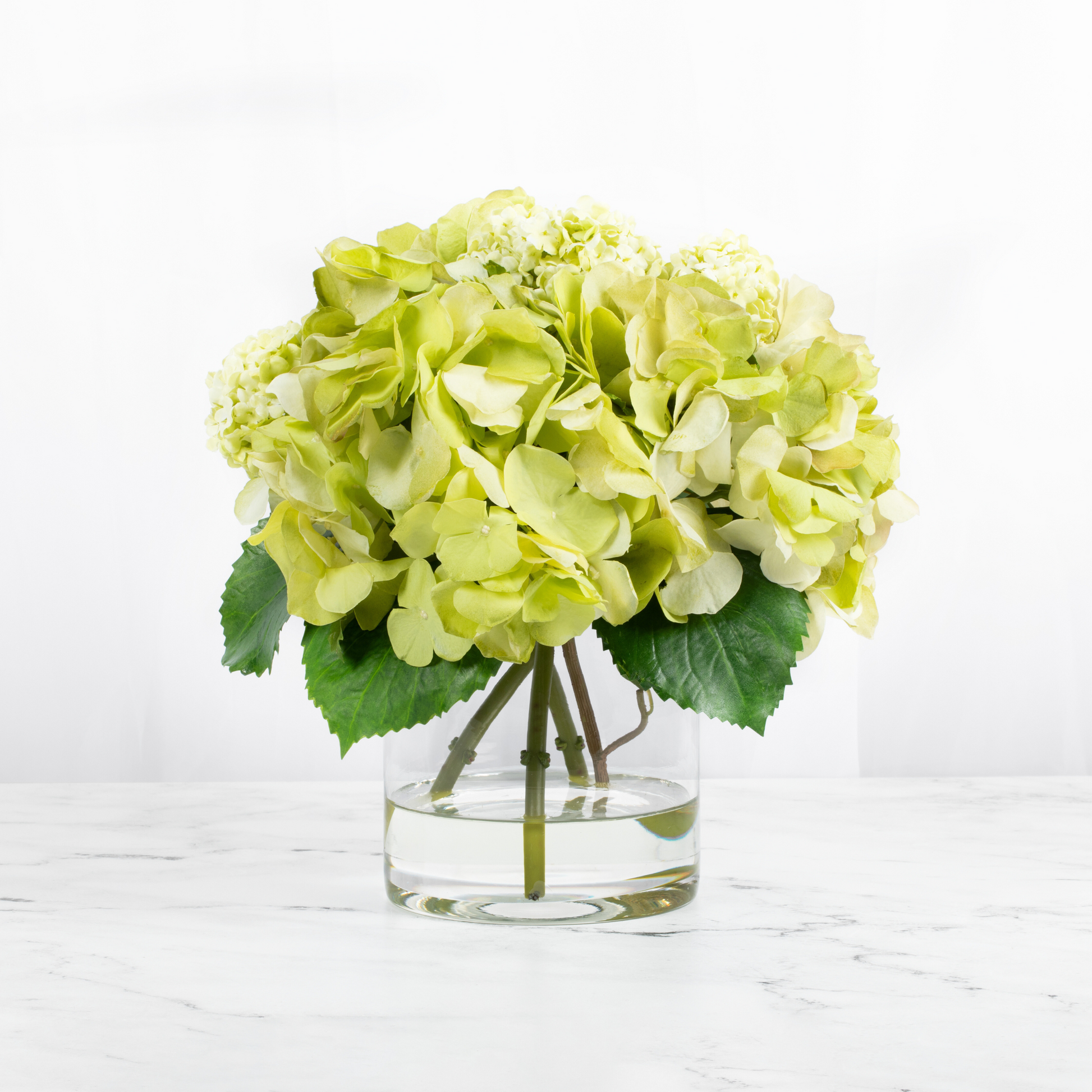 Silk hydrangea centerpiece arrangement in glass vase-0